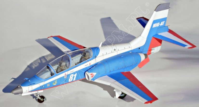 Mig-AT